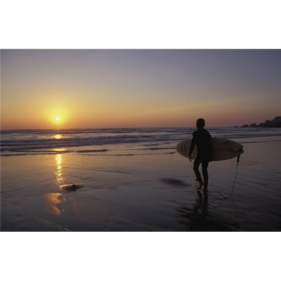 Silhouetted Surfer On Sandy Beach At Sunset Poster Print
