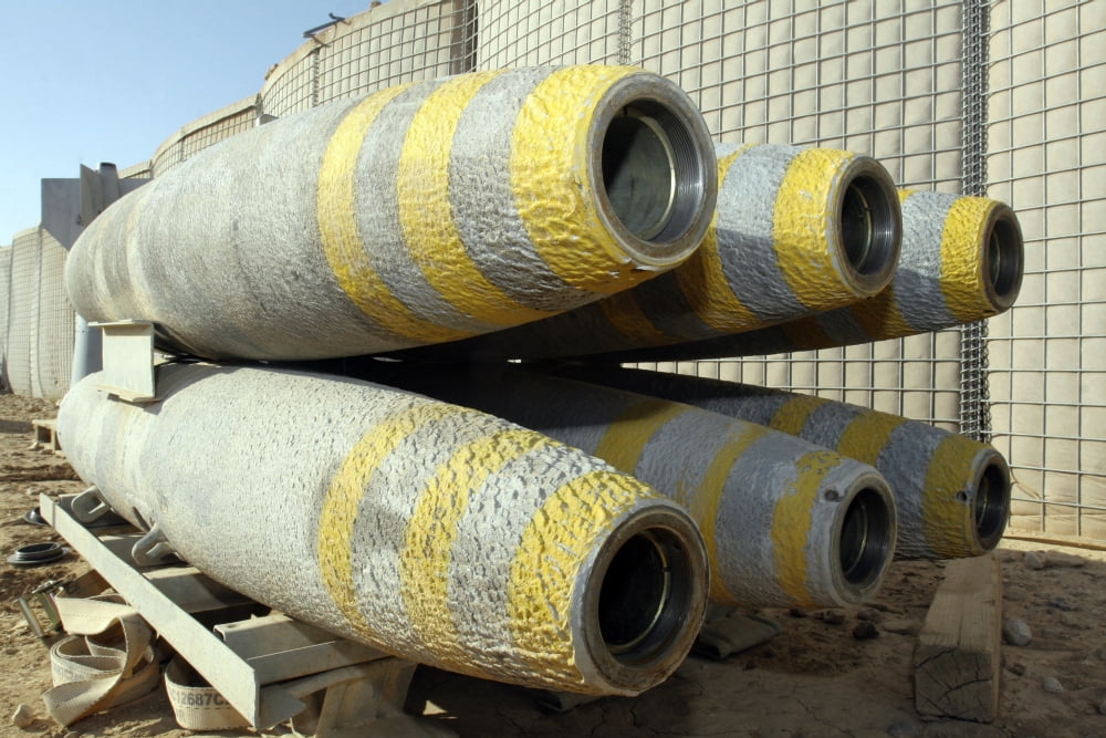 Six GBU-12 bombs sit in a rack inside a weapons storage area Canvas Art - Stocktrek Images (34 x 23)
