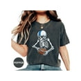 thumbnail image 1 of Skeleton Football Player T-Shirt, Skull Holding Football Graphic Tee, Perfect Gift for Sports Fans, Funny Halloween Shirt, 1 of 10