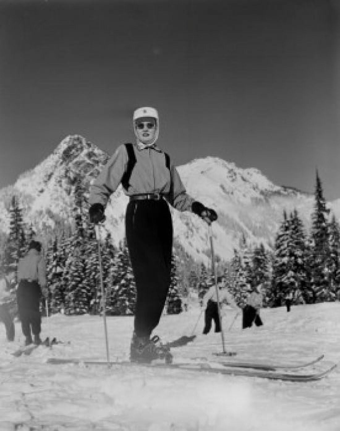 Ski Patrol woman with snowcapped mountains in background Canvas Art - (24 x 36)