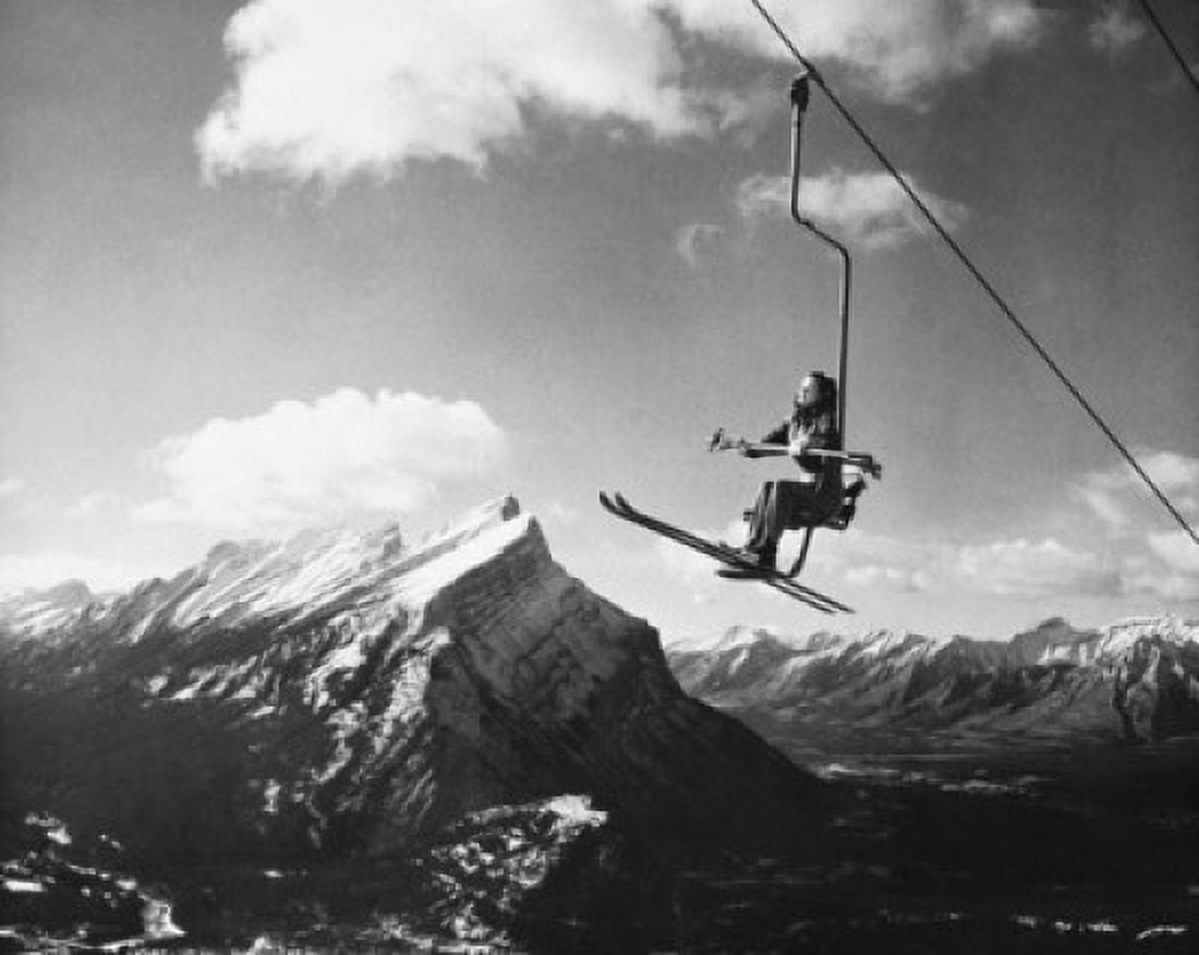 Skier sitting on a ski lift Alberta Canada Canvas Art - (18 x 24)