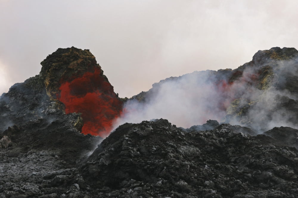 Skylight with lava reflection Puu Oo crater Big Island Hawaii Canvas Art - Martin RietzeStocktrek Images (34 x 23)