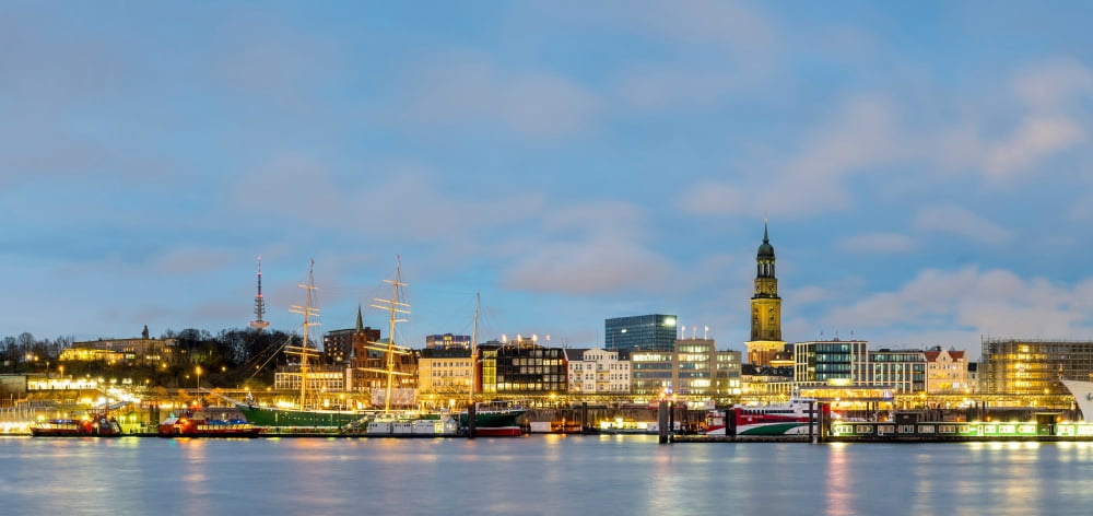 Skyline at dusk along Elbe River Hamburg Germany Canvas Art - Panoramic Images (26 x 12)