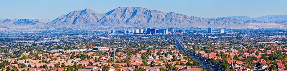 Skylines in a city with mountain range in the background Las Vegas Nevada USA Canvas Art - Panoramic Images (36 x 9)