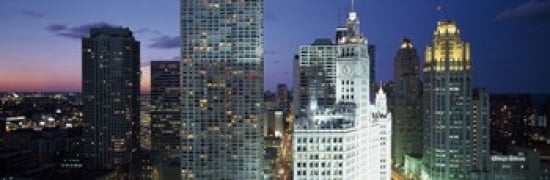 Skyscraper lit up at night in a city Chicago Illinois USA Canvas Art - Panoramic Images (36 x 12)