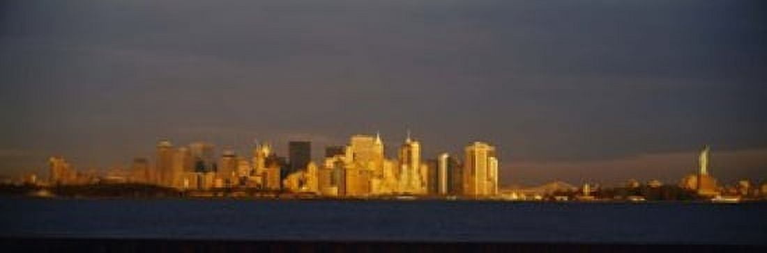 Skyscrapers and a statue at the waterfront Statue of Liberty Manhattan New York City New York State USA Canvas Art - Panoramic Images (18 x 6)
