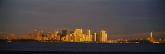 Skyscrapers and a statue at the waterfront Statue of Liberty Manhattan New York City New York State USA Canvas Art - Panoramic Images (36 x 12)