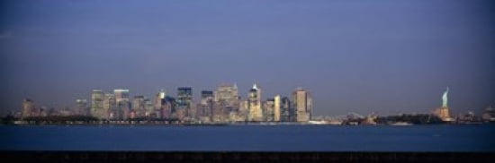 Skyscrapers and a statue at the waterfront Statue of Liberty Manhattan New York City New York State USA Canvas Art - Panoramic Images (36 x 12)