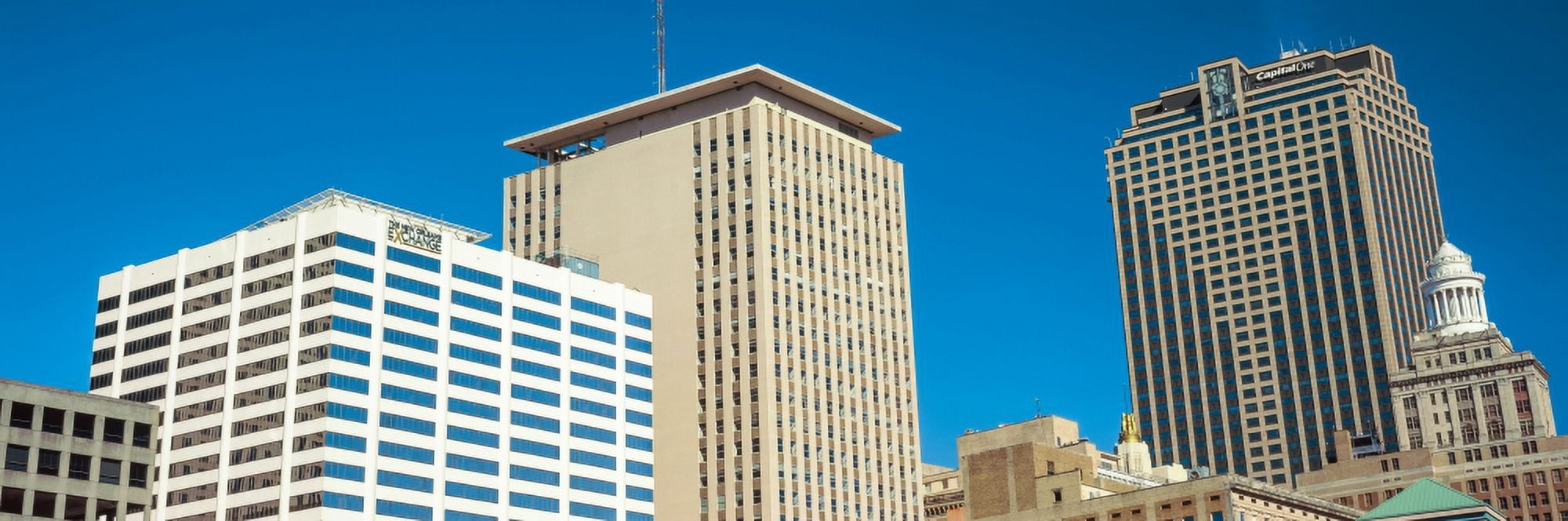 Skyscrapers in a city New Orleans Cotton Exchange New Orleans Louisiana USA Canvas Art - Panoramic Images (27 x 9)