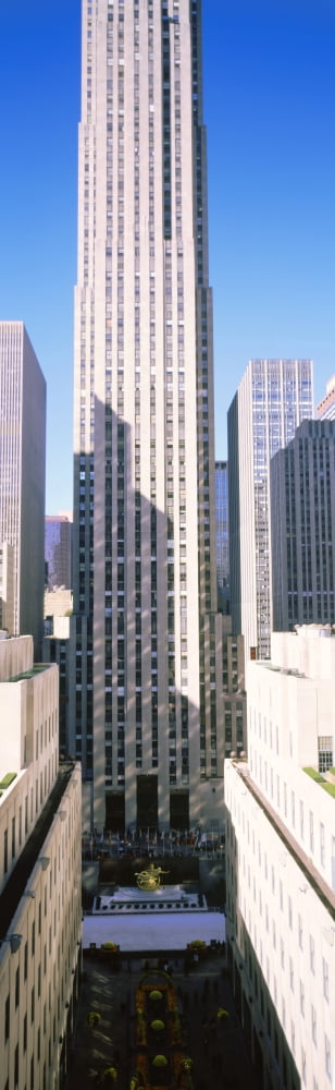 Skyscrapers in a city Rockefeller Center Manhattan New York City New York State USA Canvas Art - Panoramic Images (27 x 9)