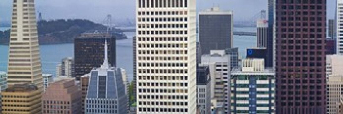 Skyscrapers in the financial district with the bay bridge in the background San Francisco California USA 2011 Canvas Art - Panoramic Images (18 x 6)