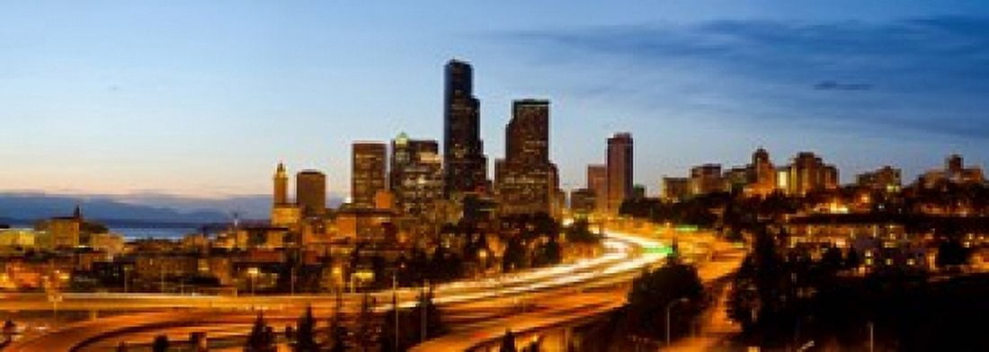 Skyscrapers lit up at dusk in a city Seattle King County Washington State USA 2013 Canvas Art - Panoramic Images (36 x 13)