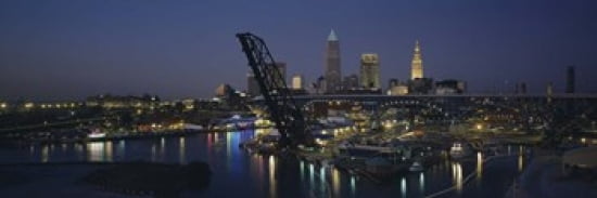Skyscrapers lit up at night in a city Cleveland Ohio USA Canvas Art - Panoramic Images (36 x 12)