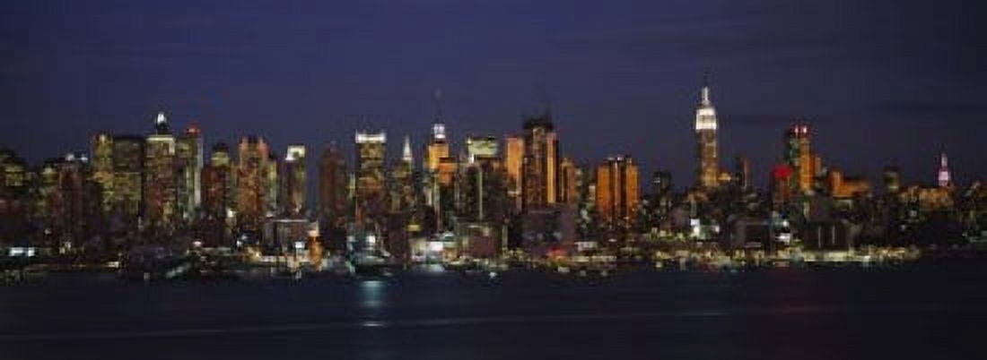 Skyscrapers lit up at night in a city Manhattan New York City New York State USA Canvas Art - Panoramic Images (18 x 7)