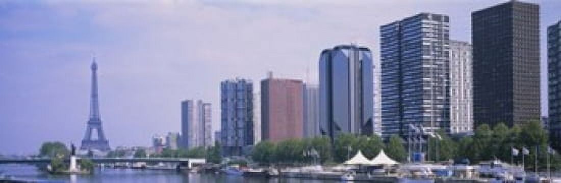 Skyscrapers at the waterfront with a tower in the background Seine River Eiffel Tower Paris Ile-De-France France Canvas Art - Panoramic Images (18 x 6)