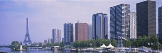 Skyscrapers at the waterfront with a tower in the background Seine River Eiffel Tower Paris Ile-De-France France Canvas Art - Panoramic Images (36 x 12)