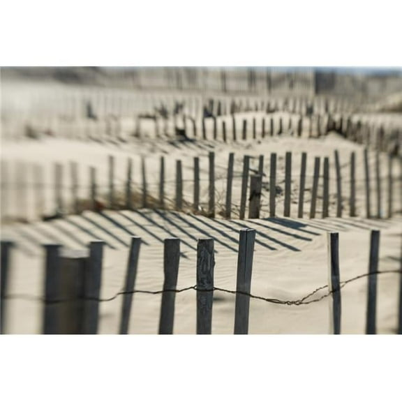 Slats of Wooden Fence Throwing Shadows On Beach Poster Print - 19 x 12
