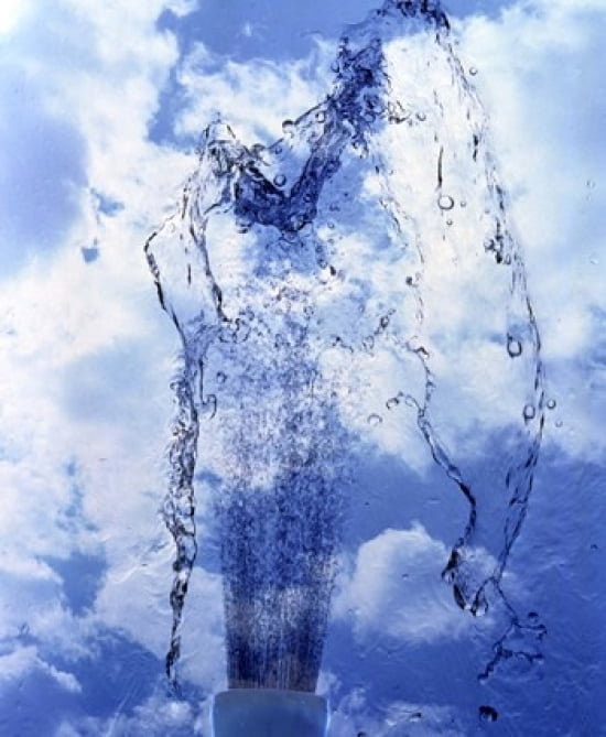 Slow motion geyser of water rising through blue sky and clouds Canvas Art - Panoramic Images (30 x 36)