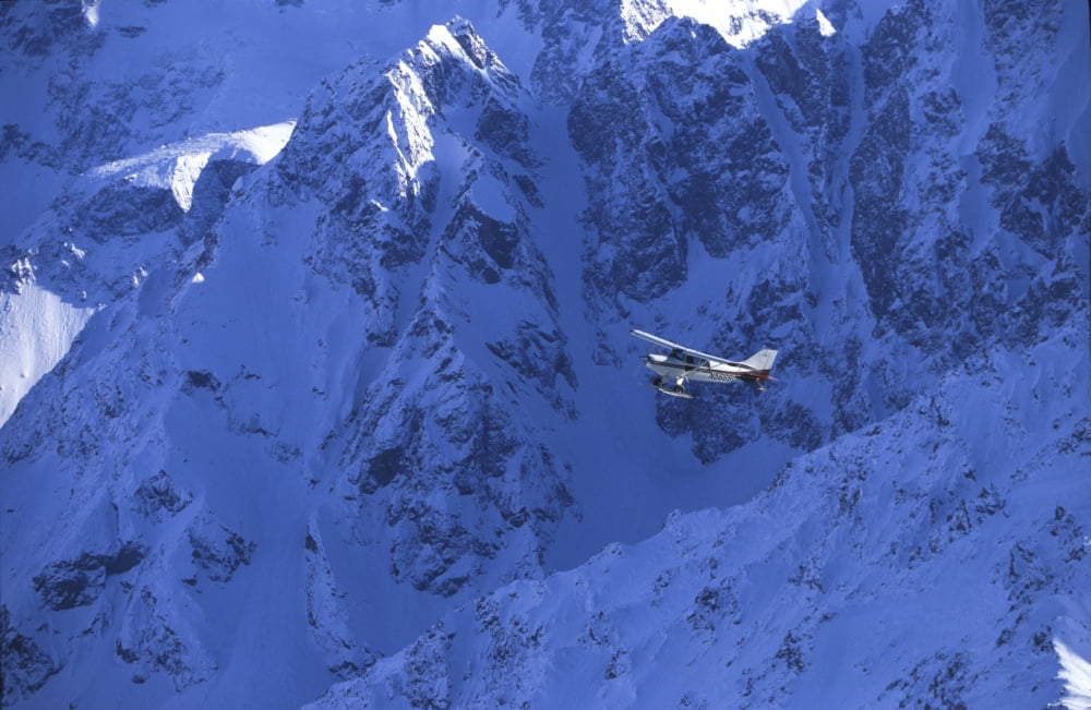 Small Plane Flying Above Chugach Mts Southcentral AkNspring Canvas Art - Jeff Schultz Design Pics (34 x 22)