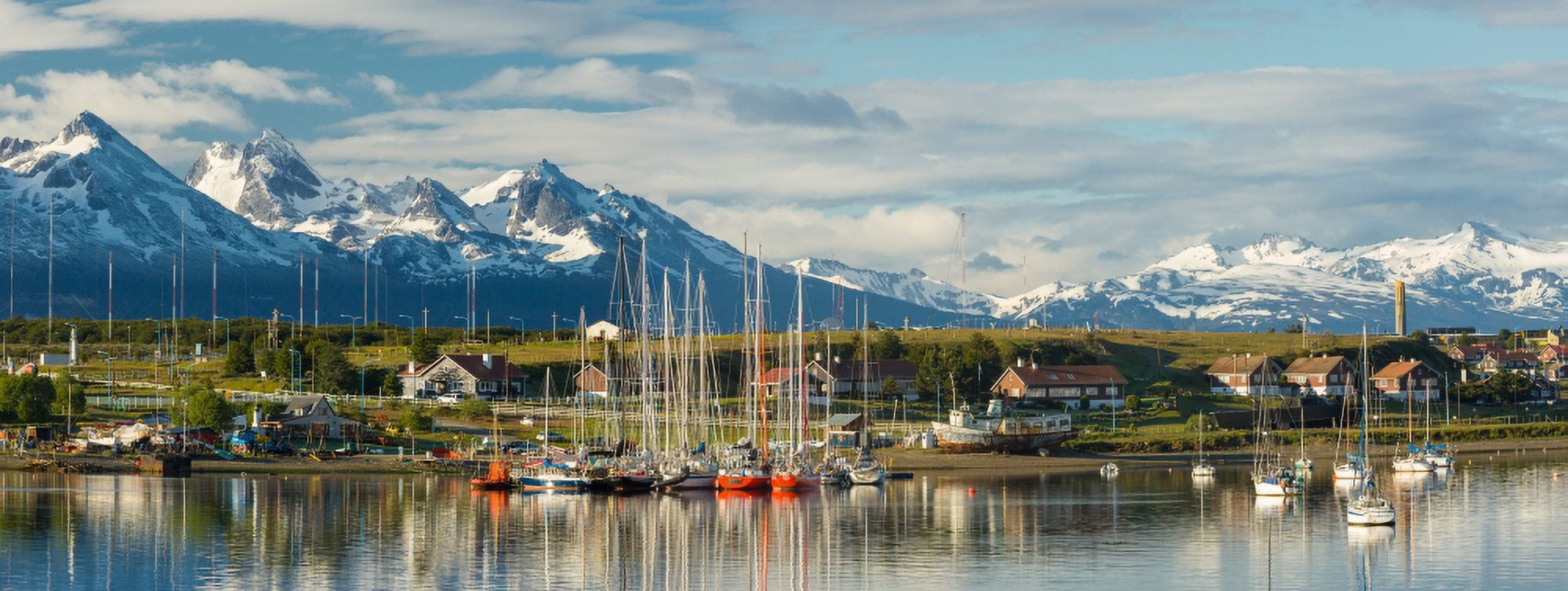 Small boat harbor and snow capped mountains around Ushuaia Tierra del Fuego Province Argentina Canvas Art - Panoramic Images (6 x 15)