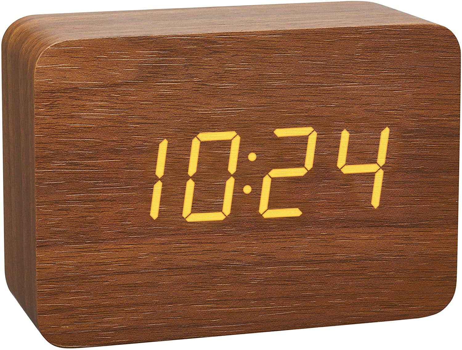 Small digital clock, wooden alarm clock on the bedside table in the