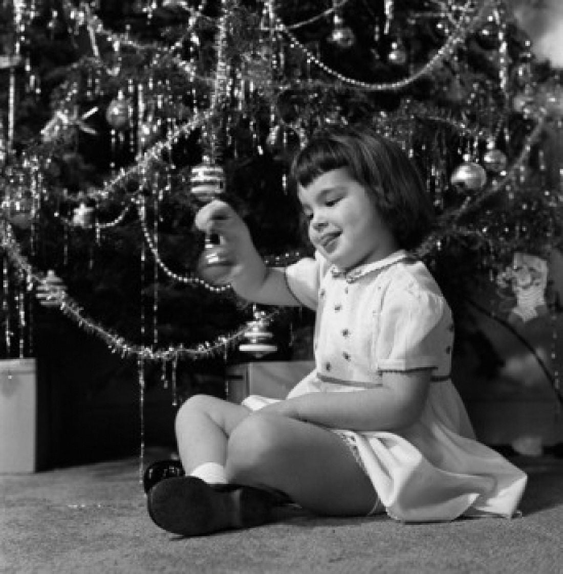Small girl holding Christmas bauble Canvas Art - (24 x 36)