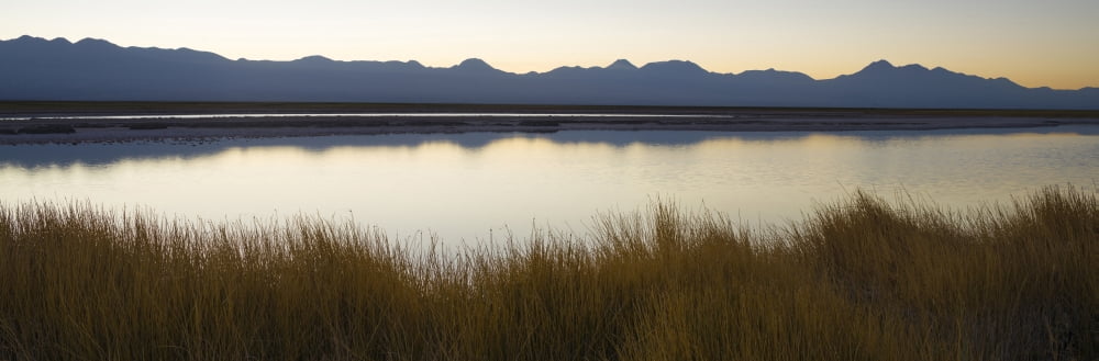 Small lake at sunrise Los Flamencos National Reserve Atacama Desert Antofagasta Region Chile Canvas Art - Panoramic Images (27 x 9)