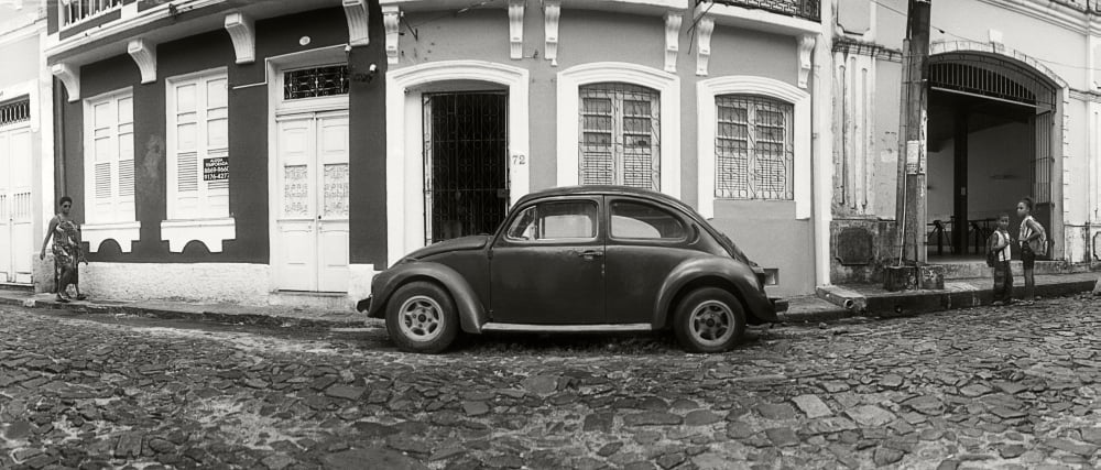 Small old car parked in front of building Pelourinho Salvador Bahia Brazil Canvas Art - Panoramic Images (36 x 12)