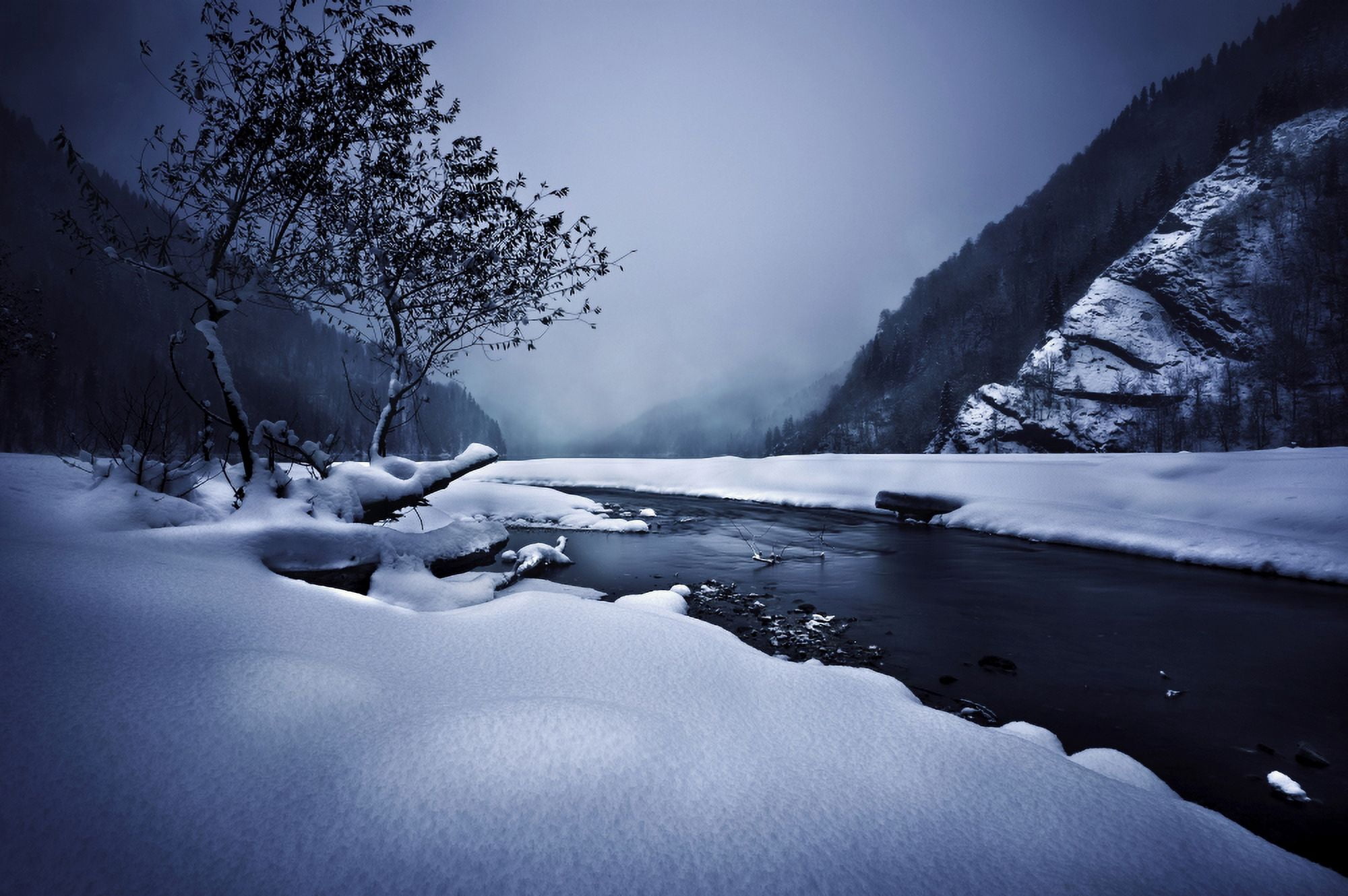 Small river in the misty snowy mountains of Ritsa Nature Reserve Canvas Art - Evgeny KuklevStocktrek Images (18 x 12)