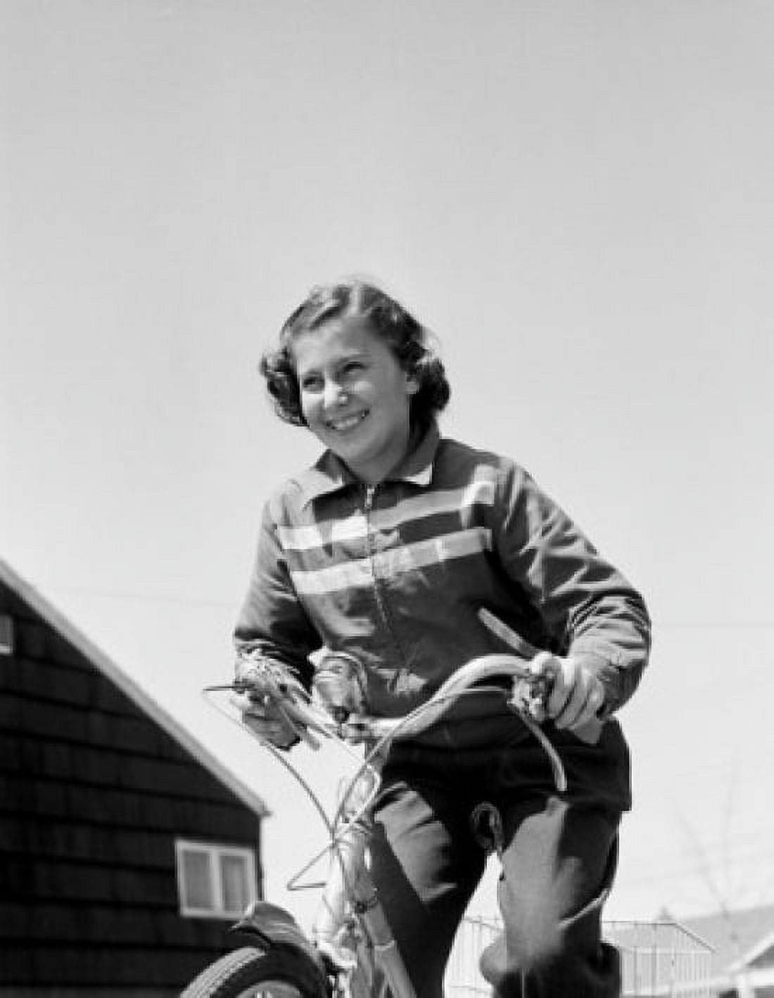 Smiling girl cycling Canvas Art - (24 x 36)