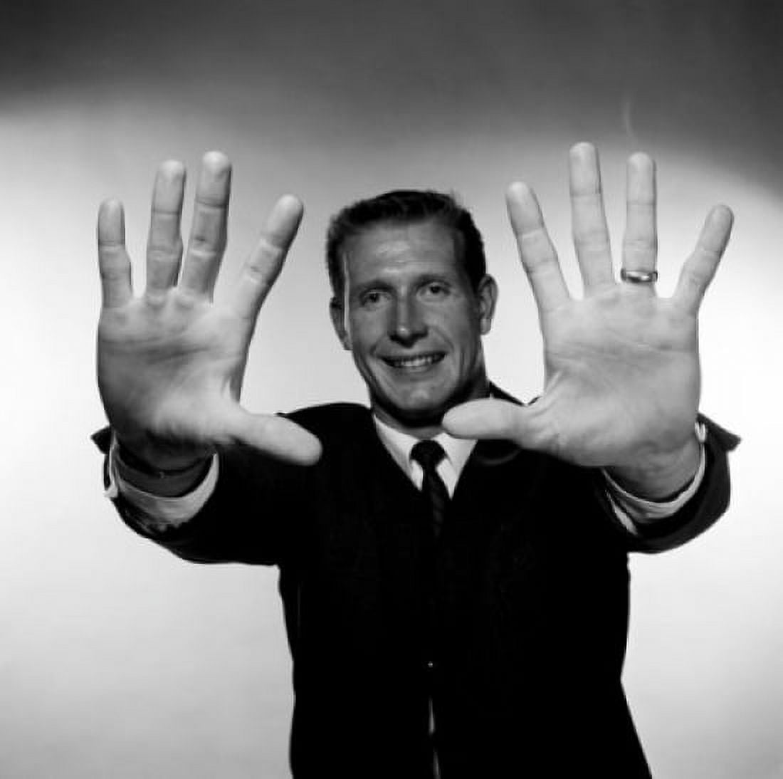 Smiling mid adult man showing stop gesture Canvas Art - (18 x 24)