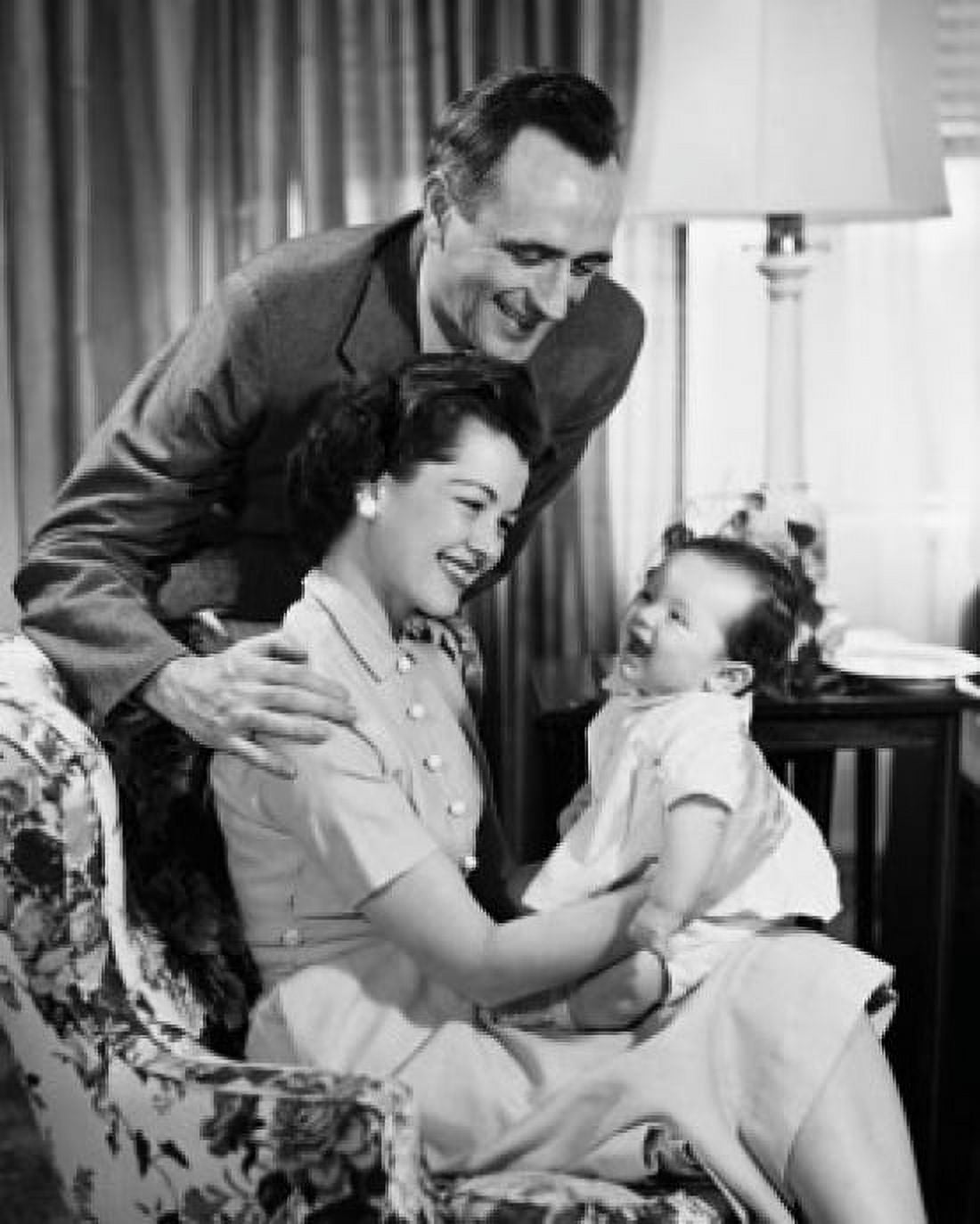 Smiling parents with their baby Canvas Art - (24 x 36)