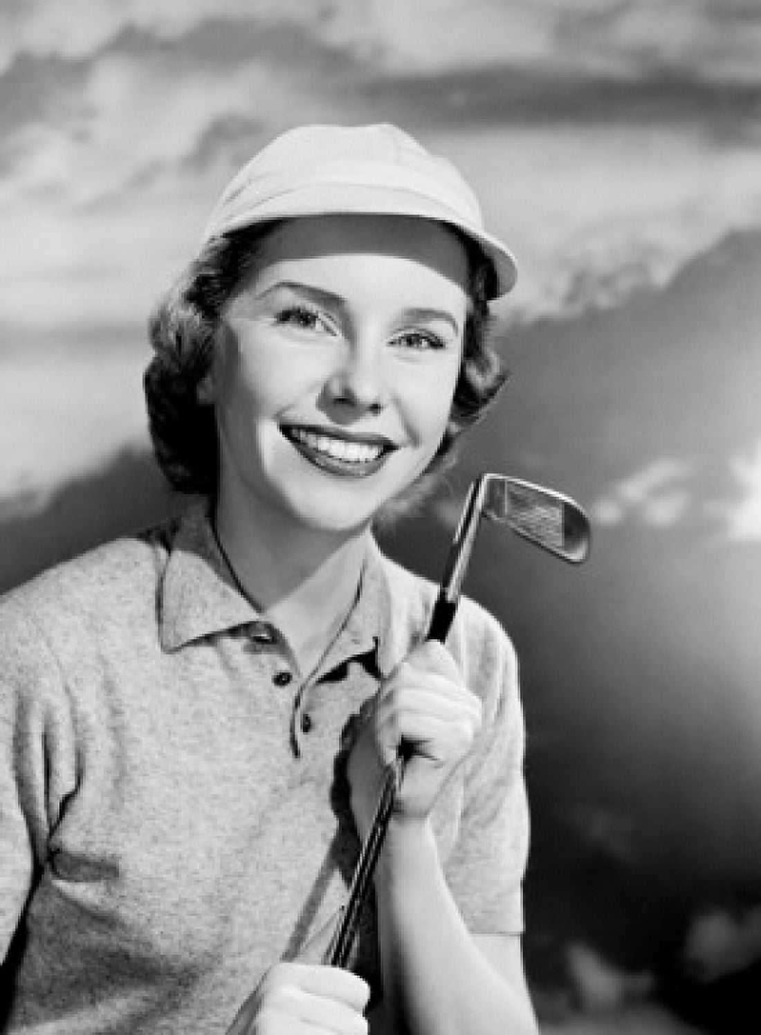 Smiling women with golf club Canvas Art - (24 x 36)