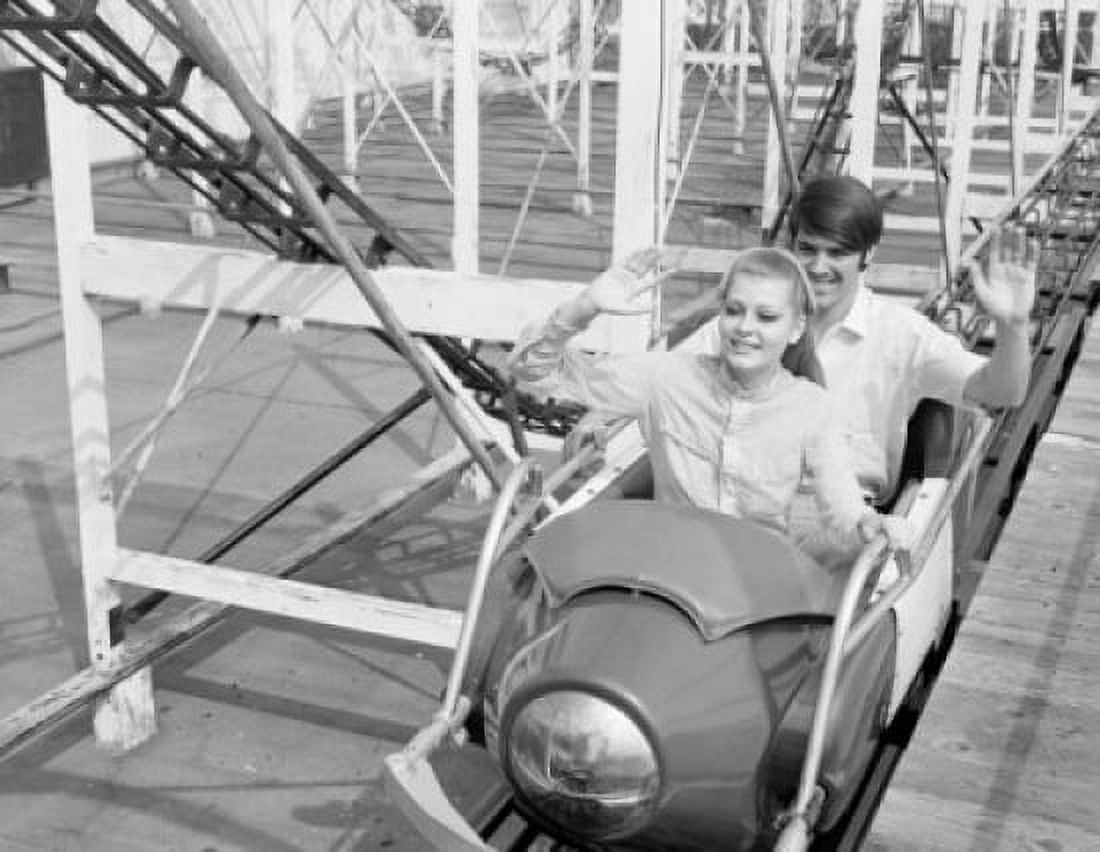 Smiling young couple on rollercoaster Canvas Art - (18 x 24)