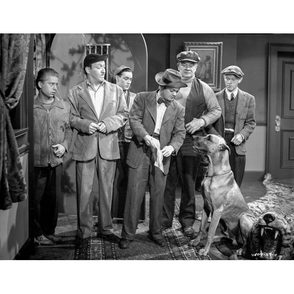 Smuggler's Cove Group of People Looking at the Dog in a Movie Scene Photo Print (24 x 30)