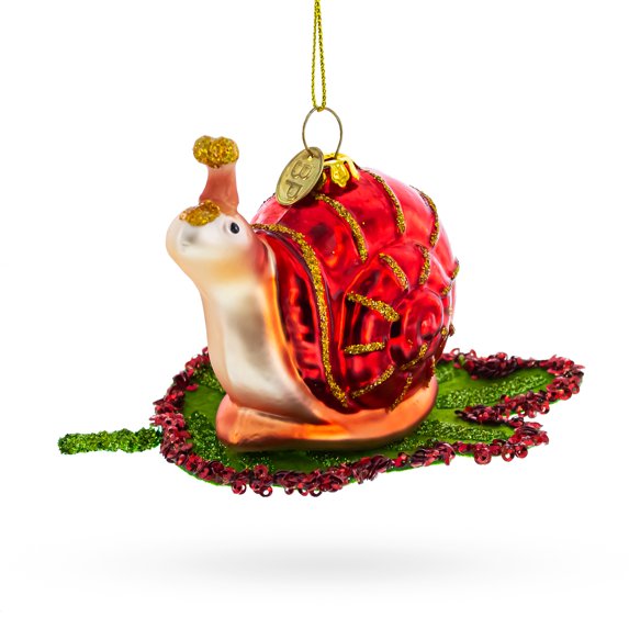 Snail Perched on a Green Leaf Glass Christmas Ornament