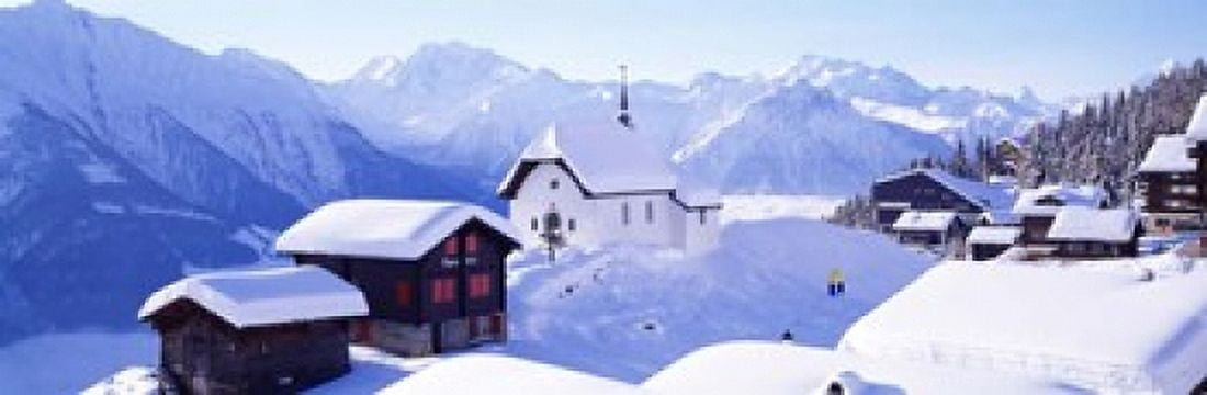 Snow Covered Chapel and Chalets Swiss Alps Switzerland Canvas Art - Panoramic Images (18 x 6)