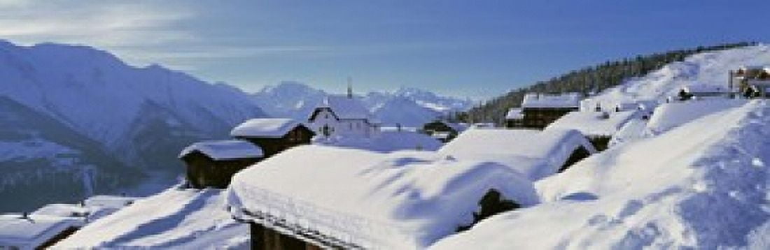 Snow Covered Chapel and Chalets Swiss Alps Switzerland Canvas Art - Panoramic Images (18 x 6)