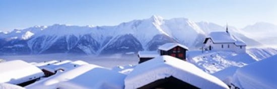 Snow Covered Chapel and Chalets Swiss Alps Switzerland Canvas Art - Panoramic Images (36 x 12)