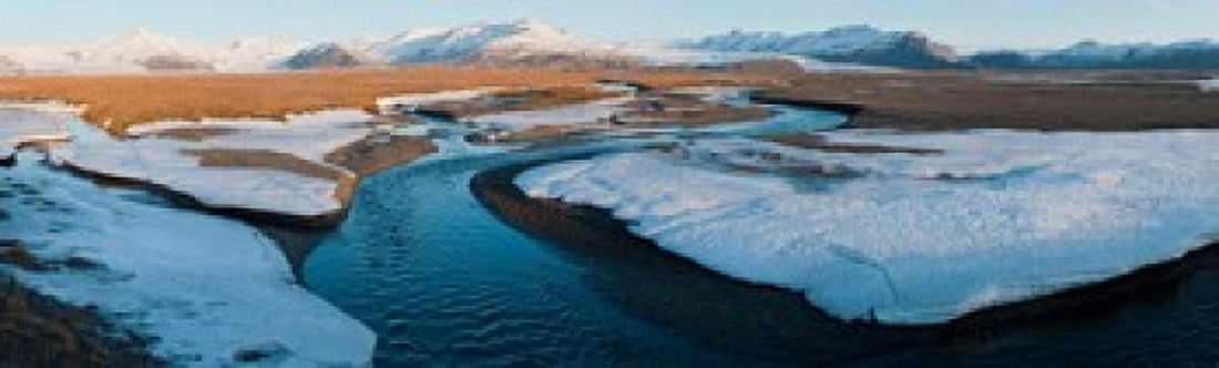 Snow along a river with mountains in background Eskey Hofn Iceland Canvas Art - Panoramic Images (15 x 5)