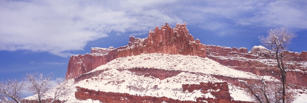 Snow covered cliff in Capitol Reef National Park against blue sky Utah USA Canvas Art - Panoramic Images (27 x 9)