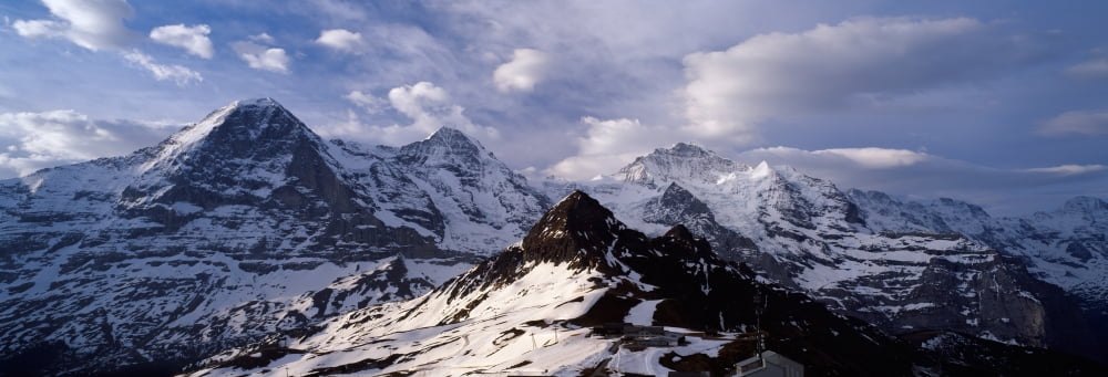 Snow covered mountains Mt Eiger Mt Monch Mt Jungfrau Mt Tschuggen Mt Mannlichen Grindelwald Bernese Oberland Switzerland Canvas Art - Panoramic Images (27 x 9)