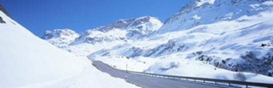 Snow covered mountains on both sides of a road St Moritz Graubunden Switzerland Canvas Art - Panoramic Images (36 x 12)