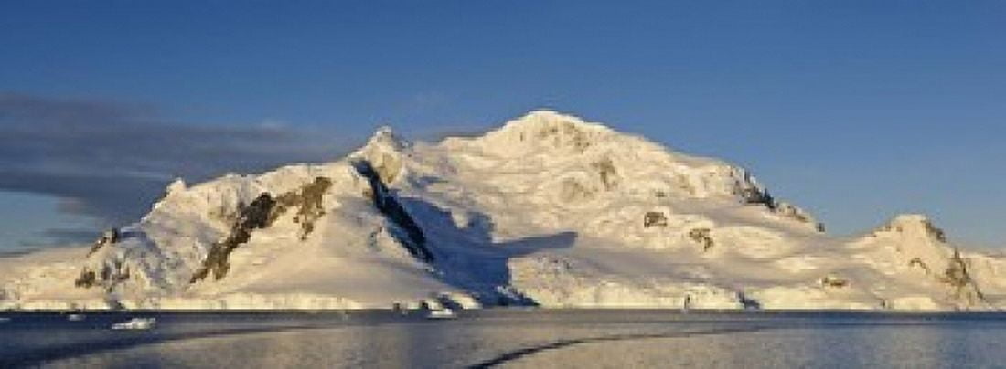 Snowcapped mountain Andvord Bay Antarctic Peninsula Canvas Art - Panoramic Images (18 x 7)
