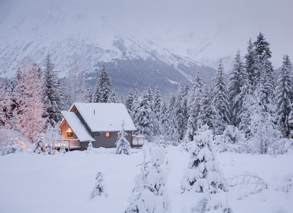 Snowcovered Home In A Wintry Meadow At Dawn With Inside Lights On Girdwood Southcentral Alaska Canvas Art - Jeff Schultz Design Pics (34 x 24)