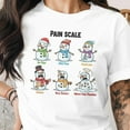 thumbnail image 1 of Snowman Pain Scale T-Shirt, Medical Office Staff Holiday Tees, Doctor/RN/Nurse Gift, Triage Staff Holiday Shirts, 1 of 4