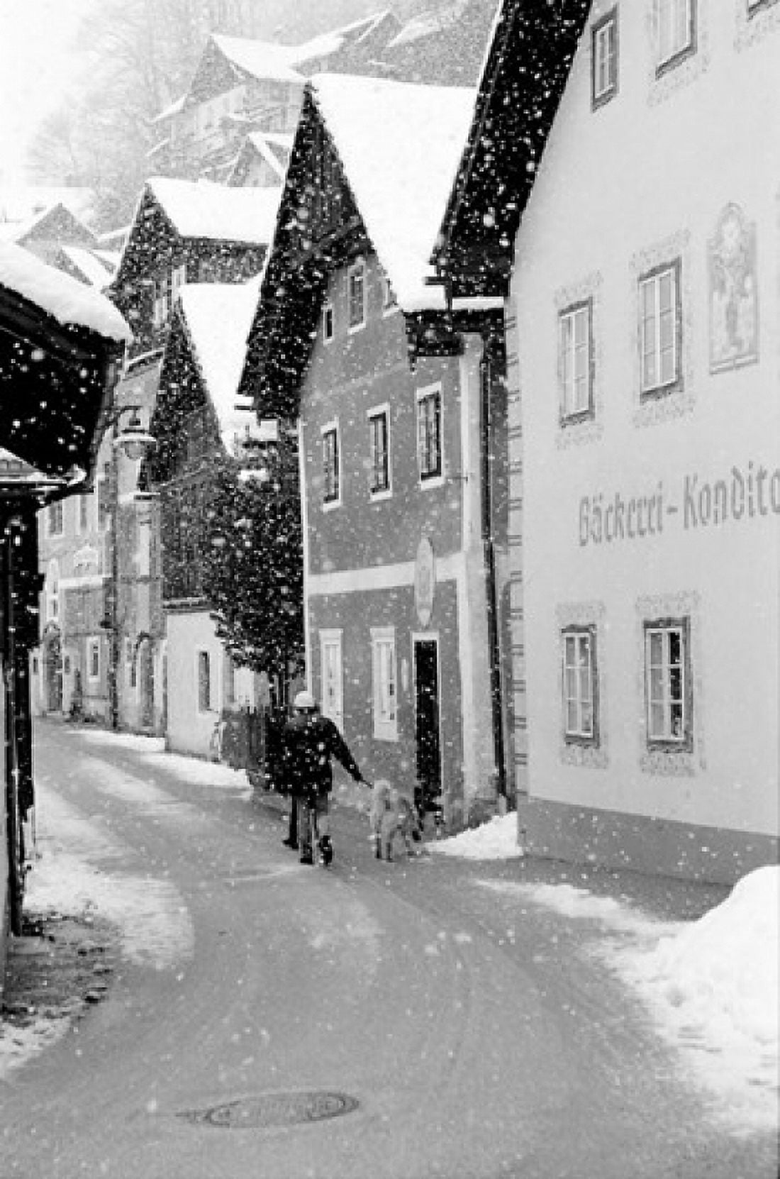 Snowy Street in Hallstat Austria Canvas Art - Walter Bibikow DanitaDelimont (19 x 28)