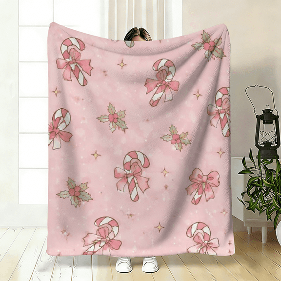 Soft warm fleece blanket, pink christmas candy checkered with bow design, suitable for winter gifting, cozy use on sofa, bed, or travel, lightweight for office and camping.