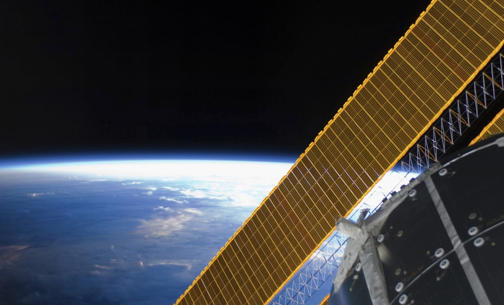 Solar array panels on the International Space Station backdropped against Earths horizon Canvas Art - Stocktrek Images (37 x 22)