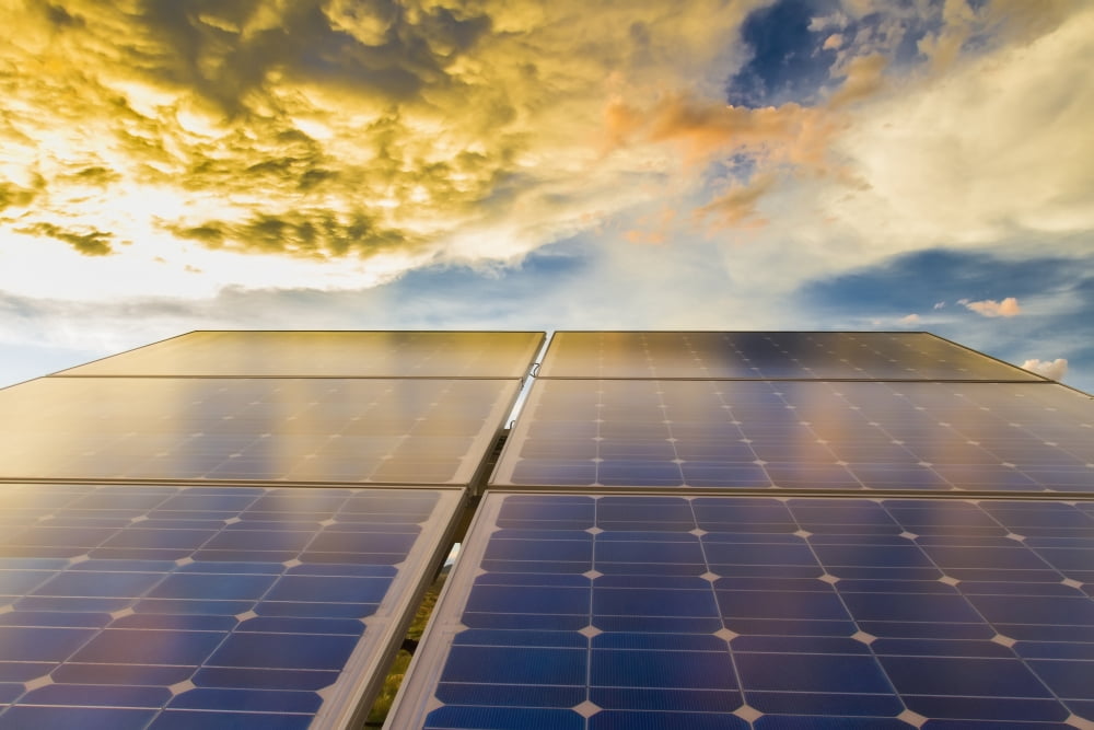 Solar panels photovoltaic array with clouds at sunsetNew mexico united states of america Canvas Art - Michael DeYoung Design Pics (19 x 12)